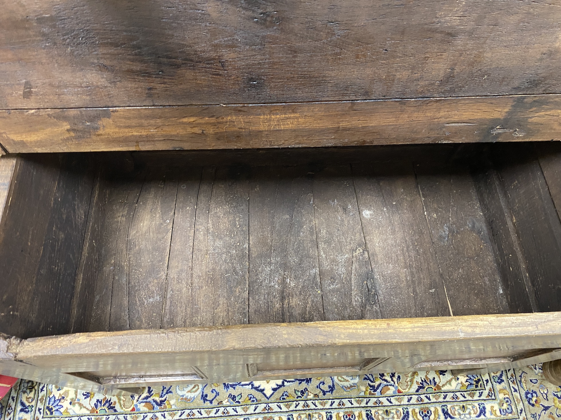 An early 18th century French oak coffer, with a triple panelled front, width 111cm, depth 62cm, height 69cm